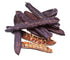 Close-up of carob pods used to extract Locust Bean Gum, a natural thickening and stabilizing agent for food applications.